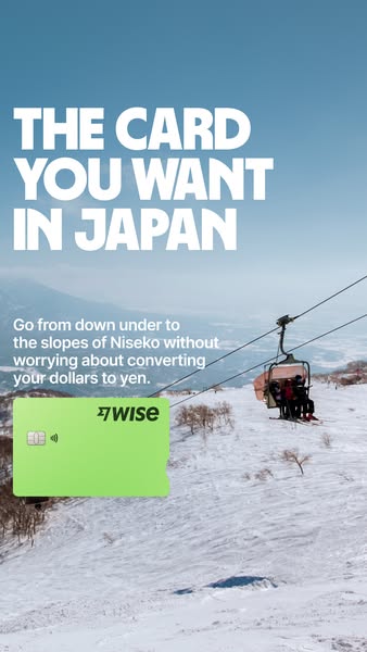 Wise ad showing a green Wise card over a ski lift photo in Niseko Japan with the headline the card you want in Japan